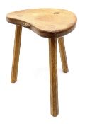 'Mouseman' oak three legged stool with dished kidney shaped seat