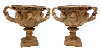 Pair of late 19th/early 20th century terracotta twin handled campagna urns or Warwick vases