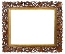 20th century rectangular wall mirror in walnut frame carved and pierced with foliage and berry decor