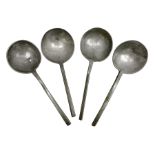 Four 17th century pewter/latten slip top spoons with round bowls