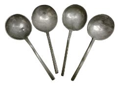 Four 17th century pewter/latten slip top spoons with round bowls