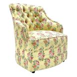 20th century button backed tub shaped bedroom chair upholstered in vintage floral fabric on yellow g