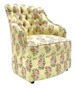 20th century button backed tub shaped bedroom chair upholstered in vintage floral fabric on yellow g