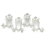 Set of four late 19th/early 20th century Continental girandole white glazed wall sconces