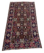 Persian red and blue ground rug