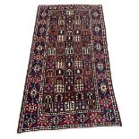 Persian red and blue ground rug