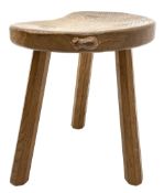 'Mouseman' oak three legged stool with dished kidney shaped seat