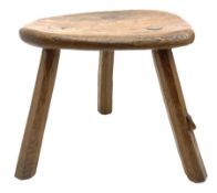 ‘Mouseman’ oak stool with shaped dished top on three tapered octagonal supports