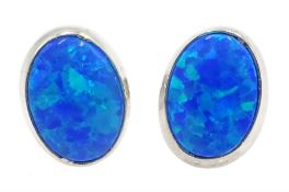 Pair of silver oval opal stud earrings