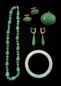 Collection of jade jewellery including bangle