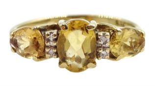 9ct gold three stone oval citrine and diamond ring