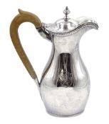 Late Victorian oval baluster silver hot water jug with fruitwood handle London 1899