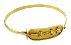 Egyptian gold bangle with hieroglyph decoration