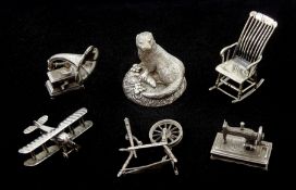 Collection of silver miniatures including a WWI fighter aeroplane the underside of the body engraved