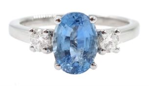 18ct white gold three stone oval aquamarine and round brilliant cut diamond ring