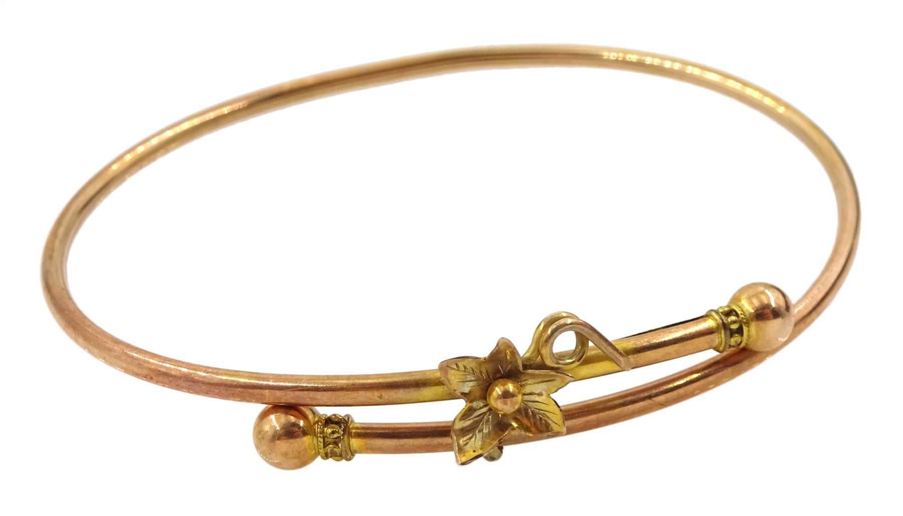 Early 20th century rose gold bangle with leaf decoration
