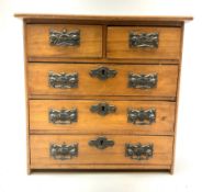 An Edwardian walnut apprentice chest of drawers