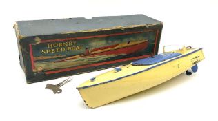 A boxed Hornby clockwork Speed Boat in cream and blue.