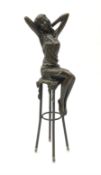 Art Deco style bronze figure of a lady seated on a stool