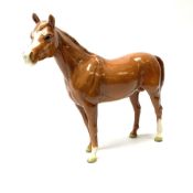 A Beswick figure modelled as a chestnut horse
