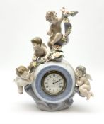 A Lladro mantel clock modelled as a globe with inset clock