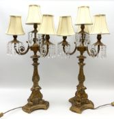 A pair of large gilt table lamps