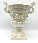 A large white glazed campagna urn