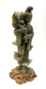 A Chinese carved jade figure modelled as Guanyin