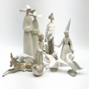 A group of nine Lladro figures