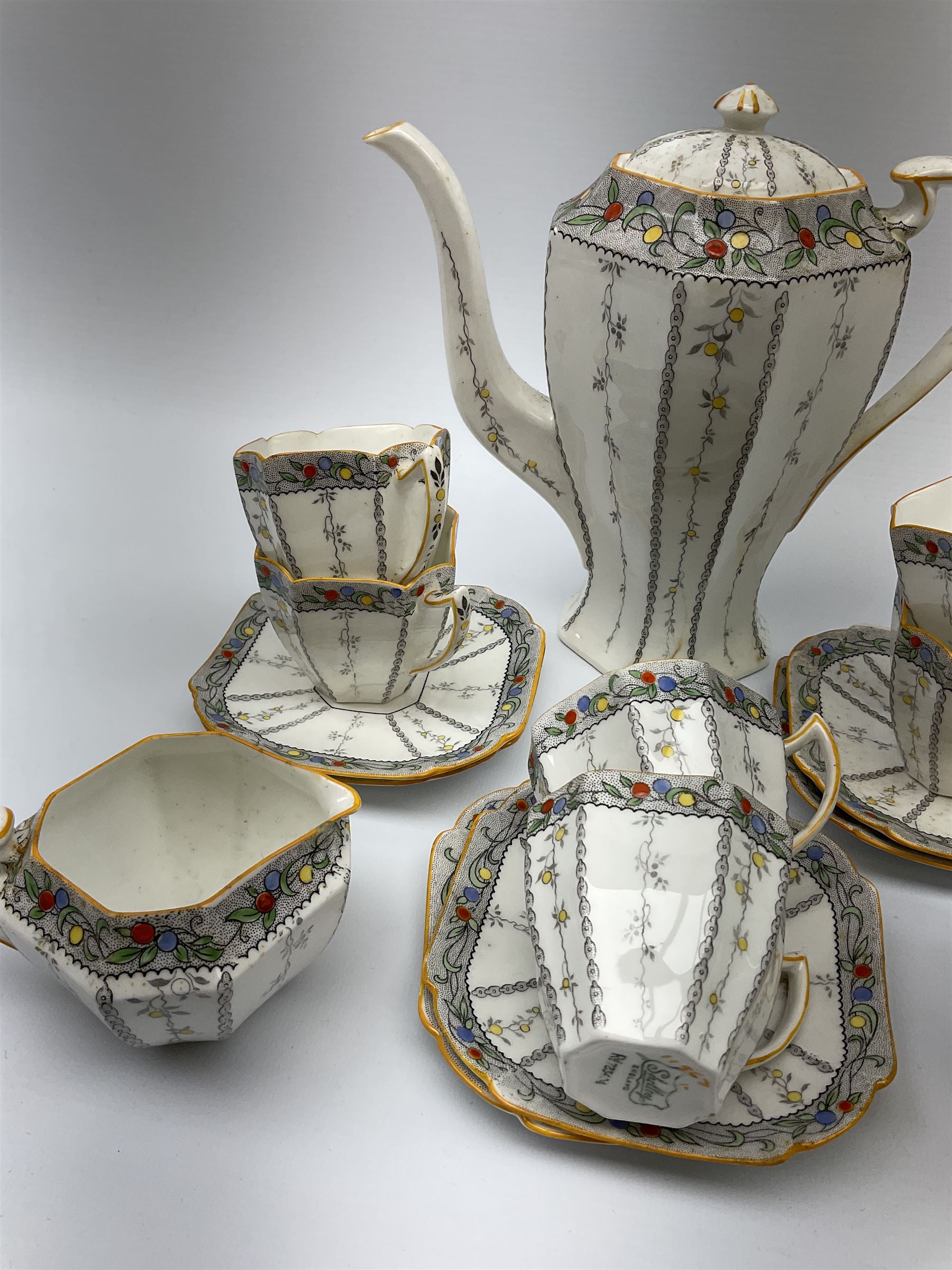 An Art Deco Shelley Queen Anne shape coffee set for six decorated in the Fruit Border pattern - Image 4 of 12