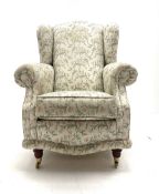 Traditional high wing back upholstered armchair