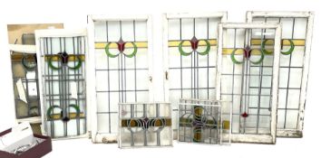 Collection of stained and leaded glass windows and panes