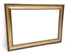 Rectangular wall mirror in swept gilt frame