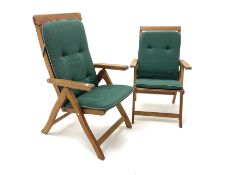 A pair of hardwood folding garden chairs