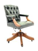 Late 20th century swivel office desk chair upholstered in green buttoned leather