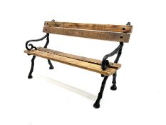 Rustic pine slatted and cast iron garden bench