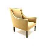 Regency shaped armchair upholstered in studded fabric