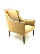 Regency shaped armchair upholstered in studded fabric