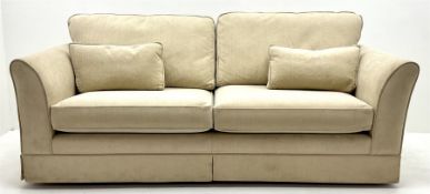 Quality large three seat sofa upholstered in cream fabric