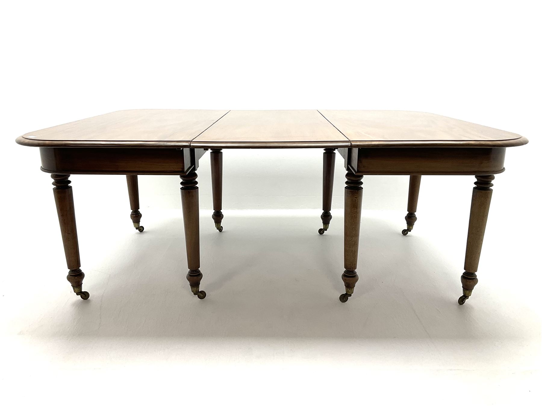 19th century figured mahogany dining table - two D-ends and leaf