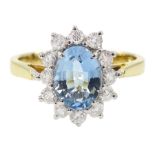 18ct gold oval aquamarine and round brilliant cut diamond cluster ring