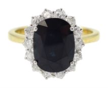 18ct gold oval sapphire and round brilliant cut diamond cluster ring