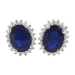 Pair of 14ct white gold oval sapphire and round brilliant cut diamond stud earrings