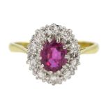 Gold oval ruby and diamond cluster ring