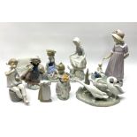 A group of nine Lladro figures