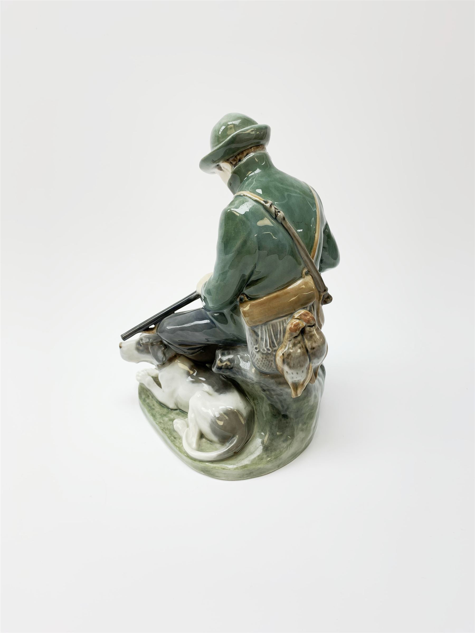 A Royal Copenhagen figure of a Huntsman and his dog modelled by Christian Thomsen No 1087 - Image 3 of 5