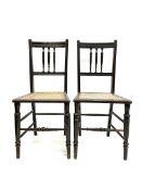 Pair of ebonised cane seat bedroom chairs