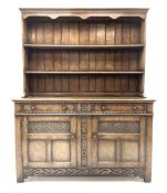 Jacobean style carved oak dresser fitted two drawers and two cupboards