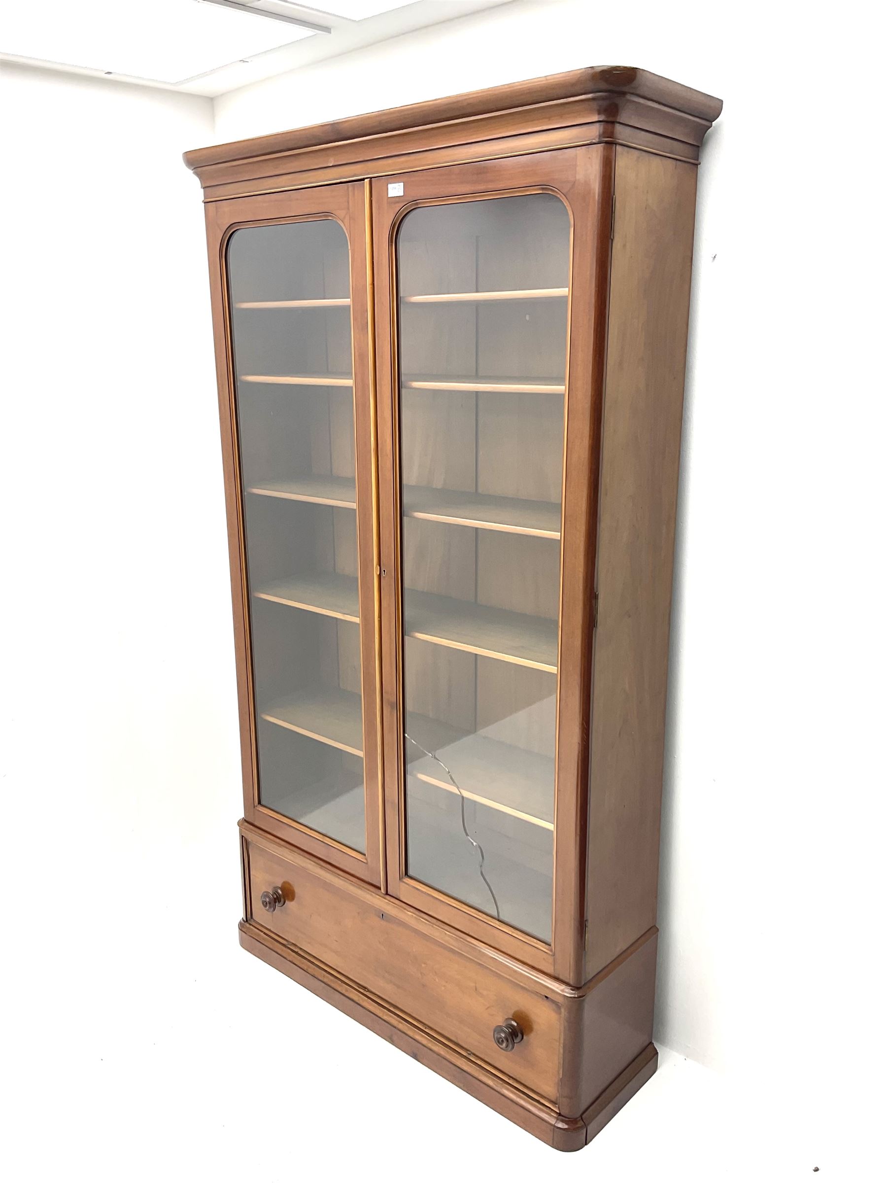 Victorian mahogany glazed bookcase enclosing adjustable shelving fitted with single drawer