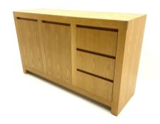Light oak sideboard fitted with two cupboards and three drawers